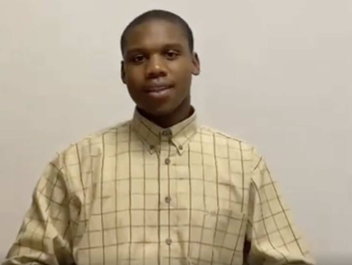 Student-athlete in a checkered shirt gives a testimonial about how AllRecruit supported his recruitment journey.